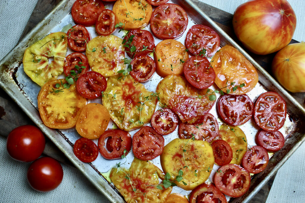 Fresh tomatoes ready to become the sweetest, most flavorful roasted tomatoes summer has ever seen! Simple and so easy.