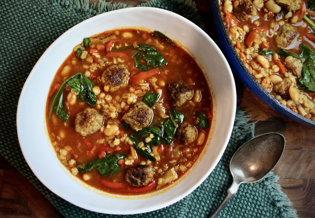 Rich & hearty Barley Mushroom Soup with meatballs and spinach. A fall favorite! Easy, delicious & great reheated as leftovers.