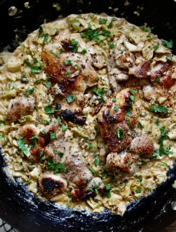 Pan Seared Chicken Thighs with Creamy Artichoke & Olive Sauce. Quick, easy, and a perfect meal for weeknights!