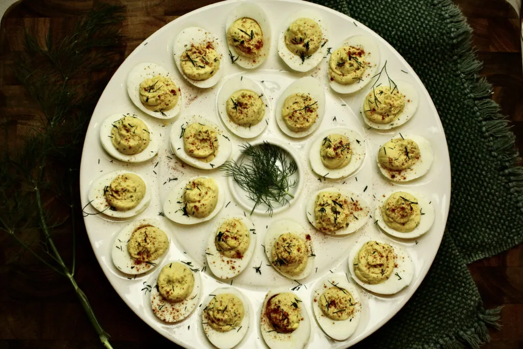 Deviled Eggs made southern style with yellow mustard, dill pickles, and a little apple cider vinegar. 