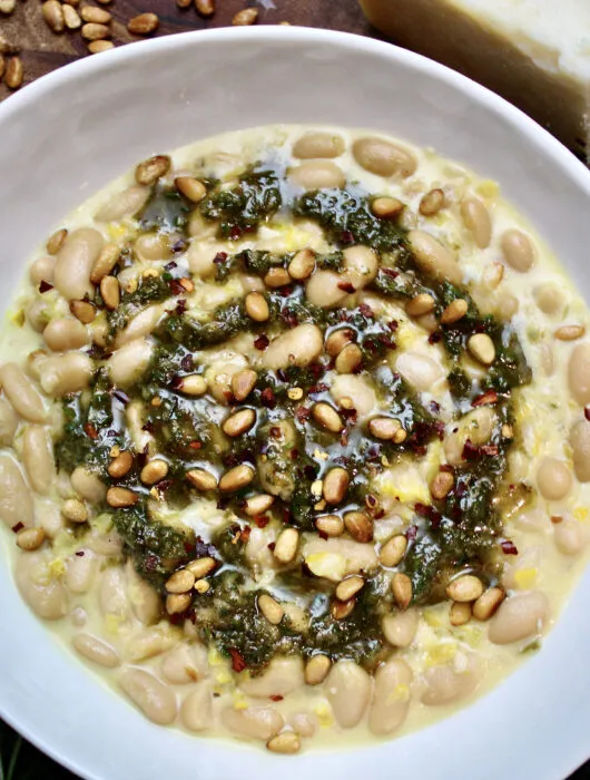 White beans with rosemary pesto and garnished with toasted pine nuts--super simple with canned beans and oh so tasty!