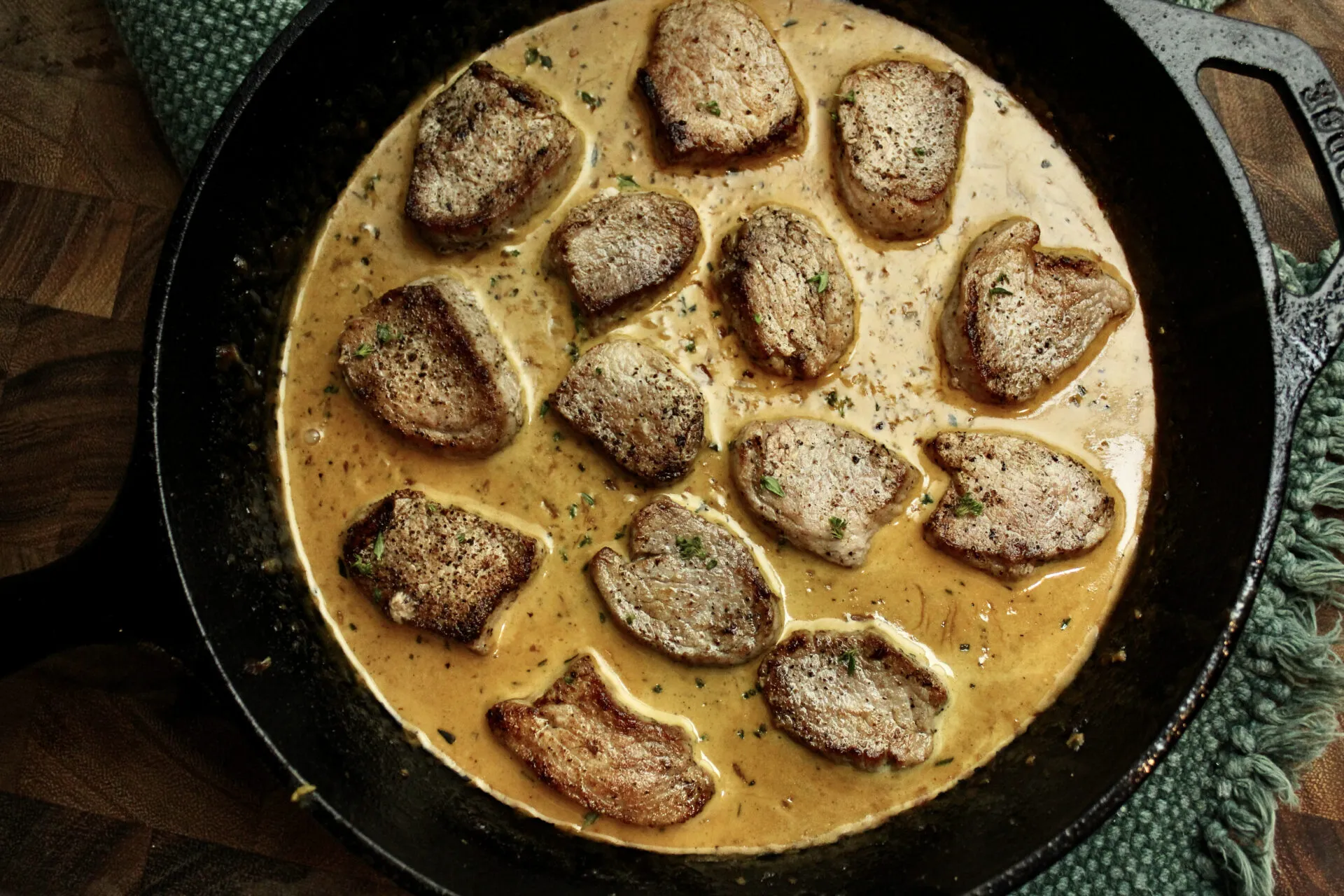 Pork Marsala made with a creamy-mustard sauce and pork medallions. The sauce is the key here, but feel free to substitute any protein of your choice!