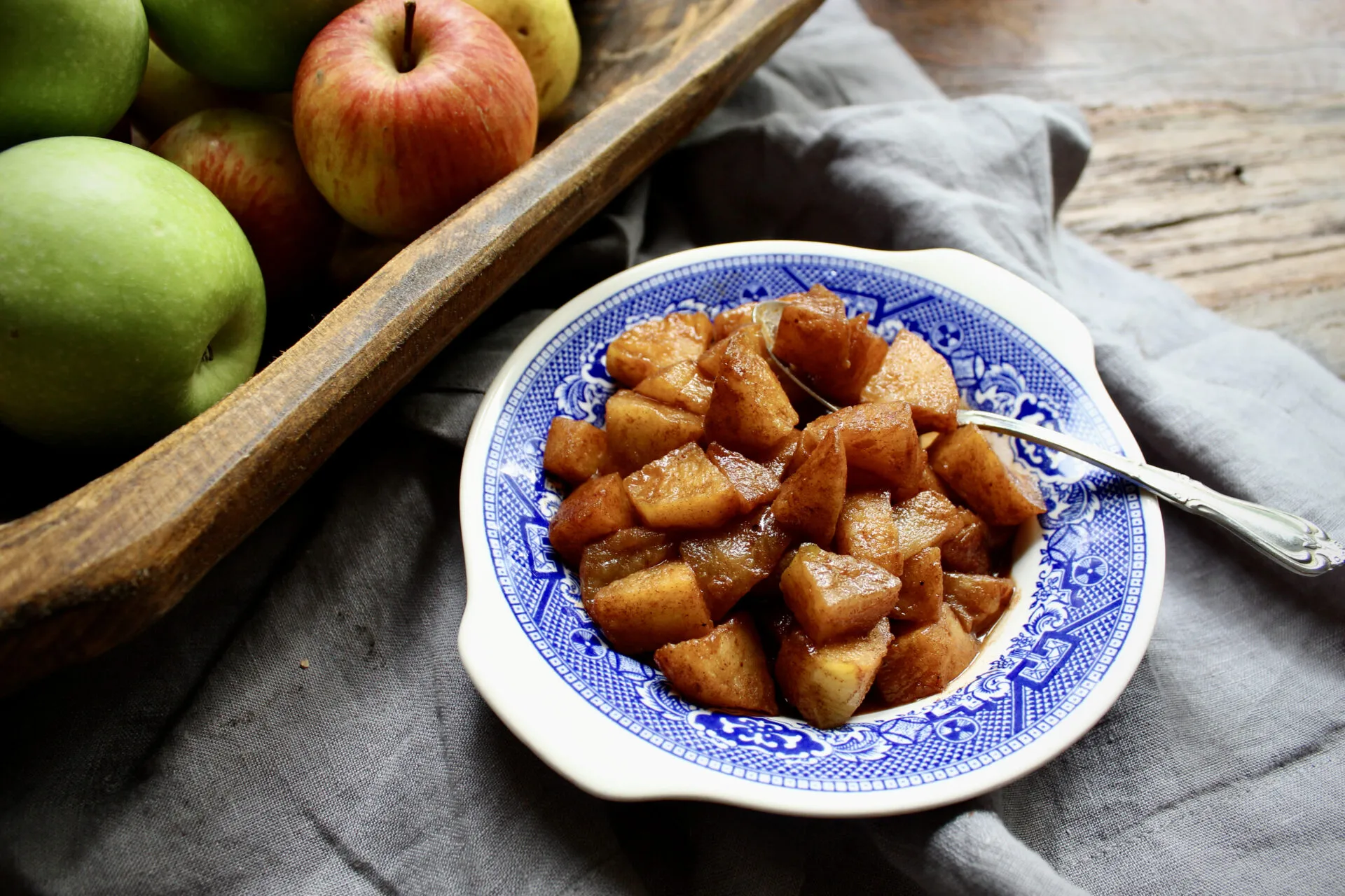 Brandied Cinnamon Stewed Apples are perfect as a side dish or spooned on top of a bowl of ice cream. So quick & so easy!