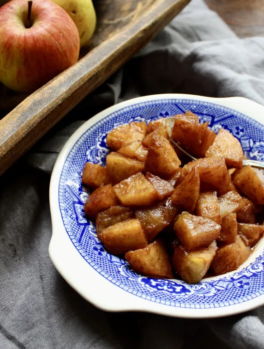 Brandied Cinnamon Stewed Apples are perfect as a side dish or spooned on top of a bowl of ice cream. So quick & so easy!