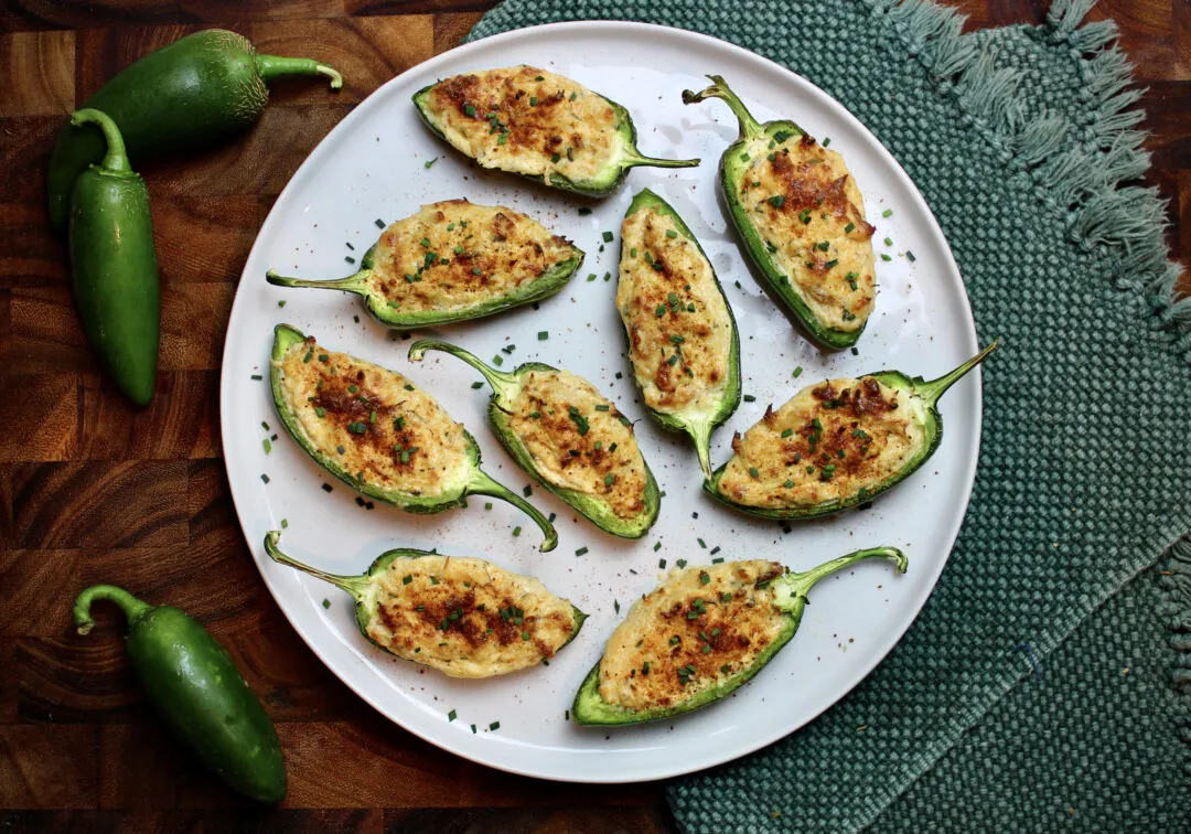 A souped up Jalapeño Pepper classic with a "crab dip" filling. Season with Old Bay & chives for the perfect appetizer.
